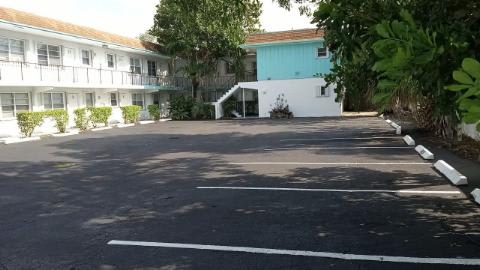 A parking lot with a white line painted on the pavement.