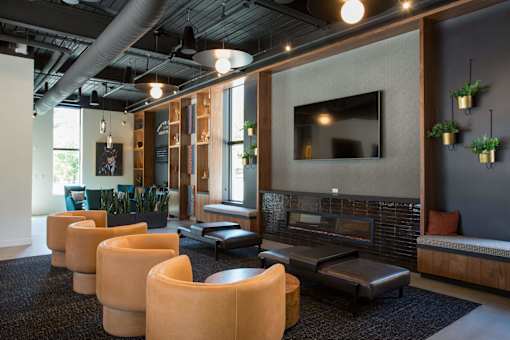A modern living room with a fireplace and a television.