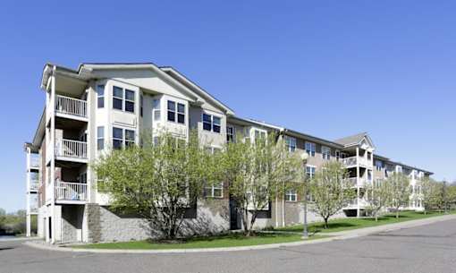 Apartment building with a clear blue sky above.