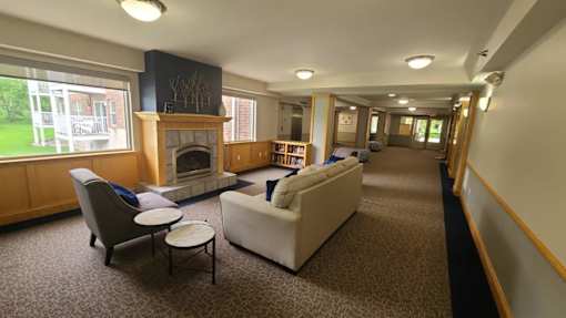 A living room with a fireplace and a couch.