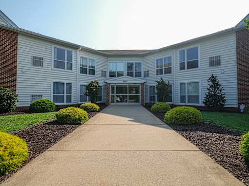 A building with a long walkway in front of it.