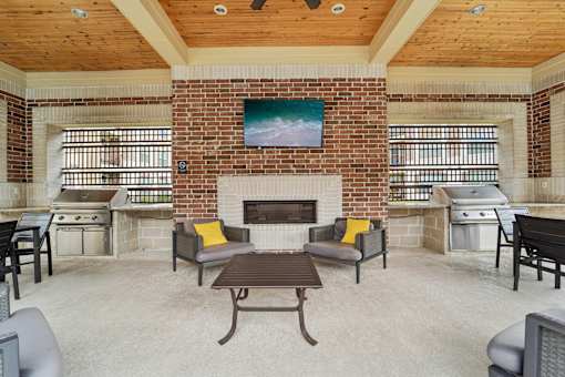Patio with fireplace at Kings Landing, Kingwood, TX