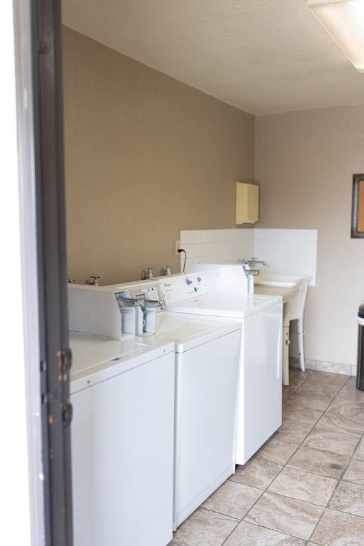 A white sink is in a small bathroom.
