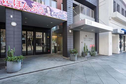 The entrance to a building with a sign that reads "The Mavetan".