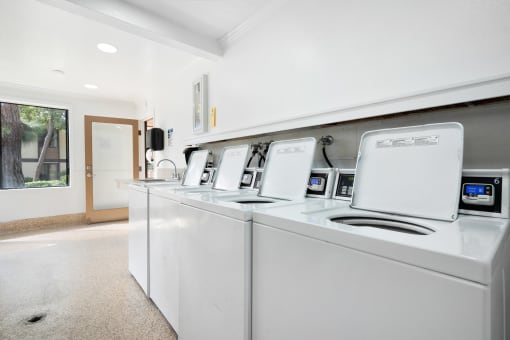 the laundry room is equipped with washes and dryers