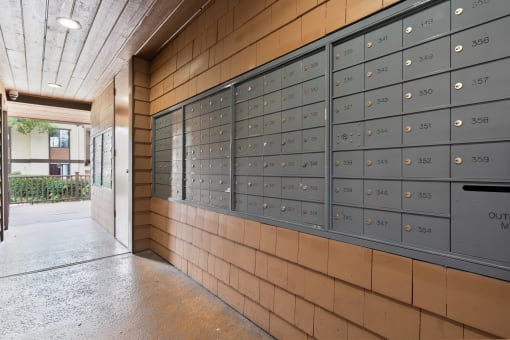 the lockers at the front of the building are full of mail