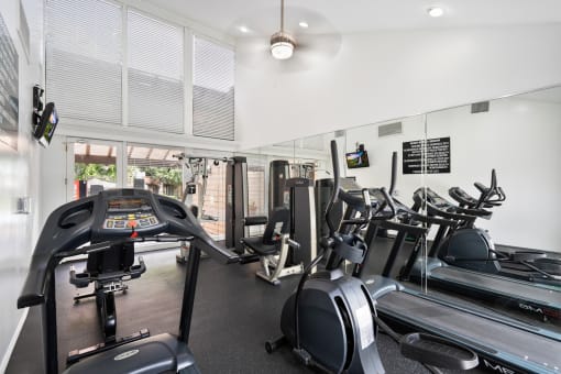 the gym has cardio equipment and treadmills in it