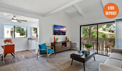 A living room with a $199 deposit sign.