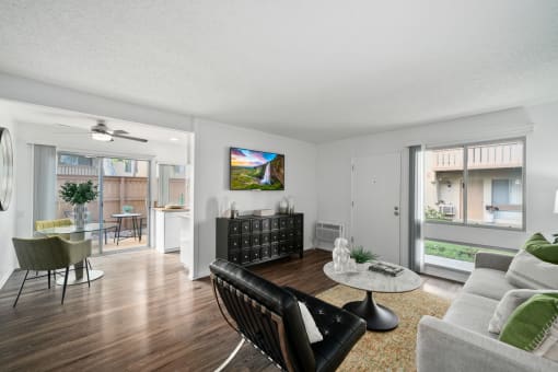 a living room with a couch and a chair and a table