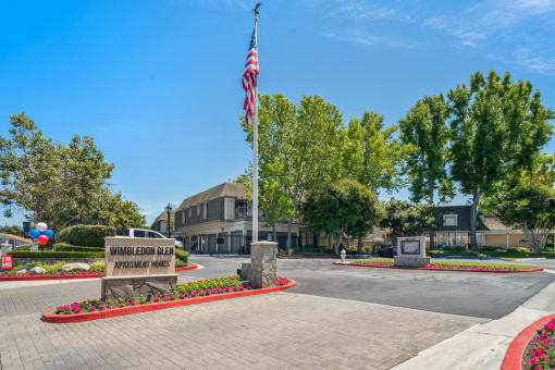 a flagpole with an american flag in front of a building