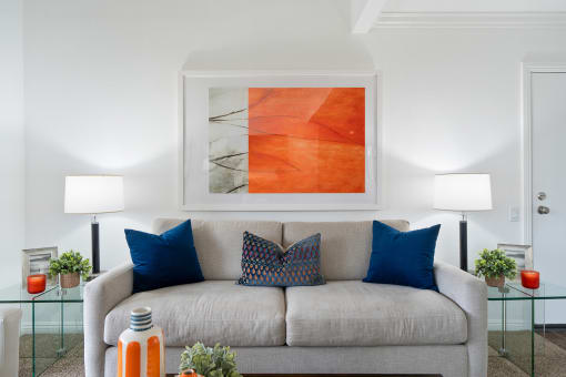 a living room with a couch and pillows