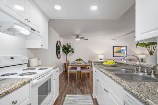 a kitchen and dining area in a 555 waverly unit