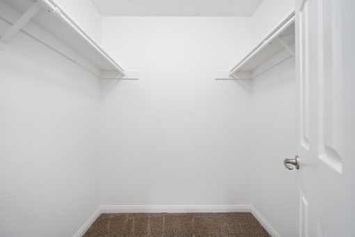 a walk in closet in a 555 waverly unit