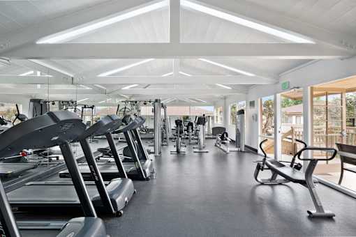 A gym with treadmills and exercise equipment.