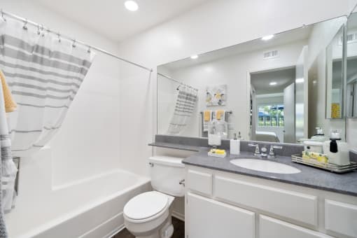 a bathroom with a sink toilet and a shower