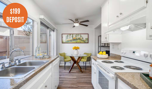A kitchen with a $199 deposit sign.