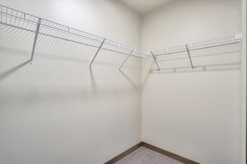 Empty shelves in a white room.