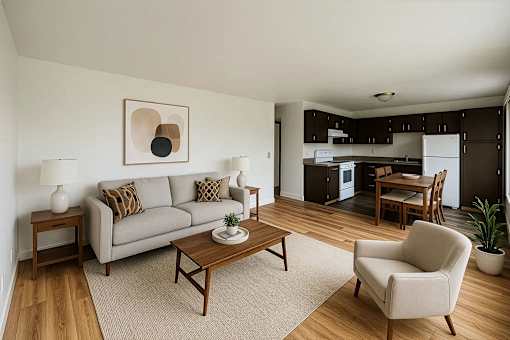 A living room with a couch, chair, and coffee table.