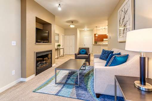 A living room with a fireplace and a couch.