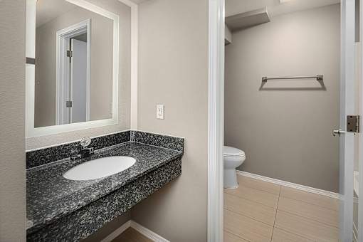A bathroom with a sink and toilet.