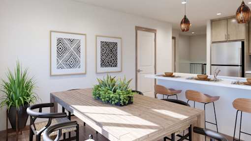 A modern dining area with a wooden table and chairs.