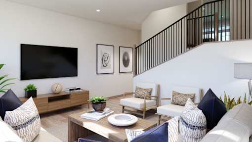 A living room with a sofa set, a coffee table, and a TV on the wall.
