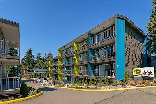 A Raleigh apartment complex with a blue and yellow building.