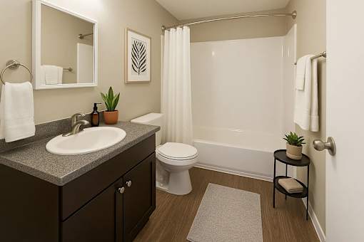 A bathroom with a white toilet and a white shower curtain.