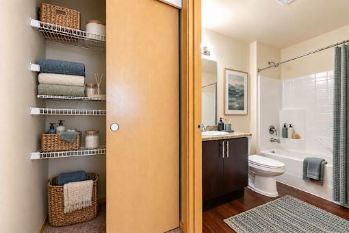 A bathroom with a toilet, sink, and shower.