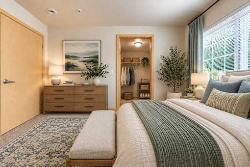 A bedroom with a large bed and a painting on the wall.