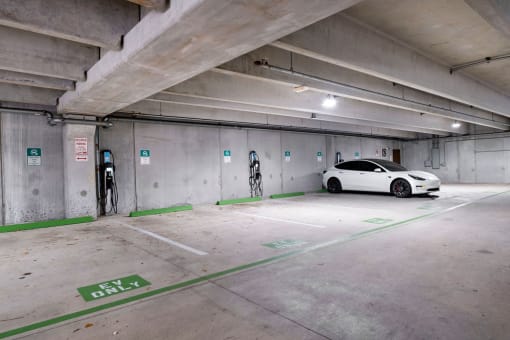 a white car parked in a parking garage