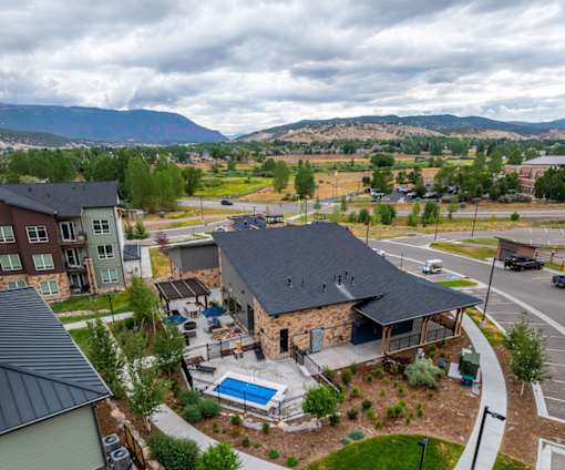 A residential area with houses and a swimming pool.