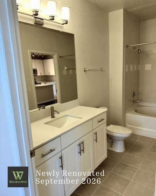 A bathroom with a white toilet and sink.