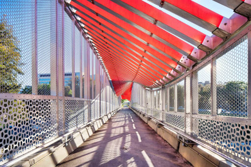 a bridge with an orange and white bridge