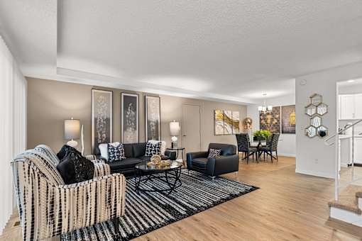 A living room with a black and white striped couch.