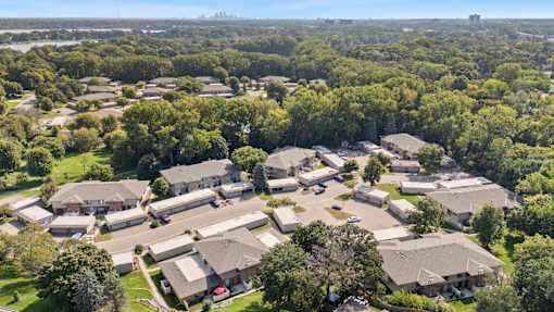 A bird's eye view of a residential area with houses and trees.