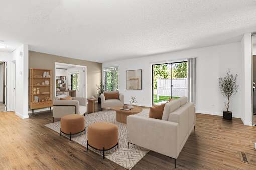 A living room with a white couch and a coffee table.