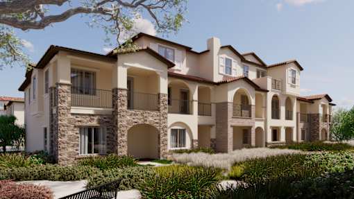 A large, multi-story residential building with balconies and arched windows.