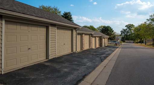 A row of garages on a sunny day.