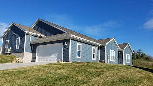A blue house with a garage door that says "CLOSED".
