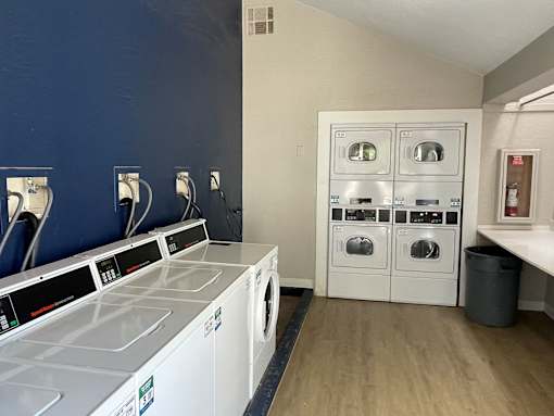 A laundry room with a washer and dryer.