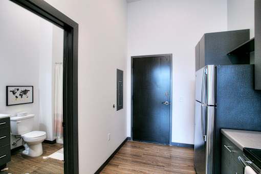 Apartment entryway with bathroom and kitchen access at The Traveler Apartments, Omaha, 68131