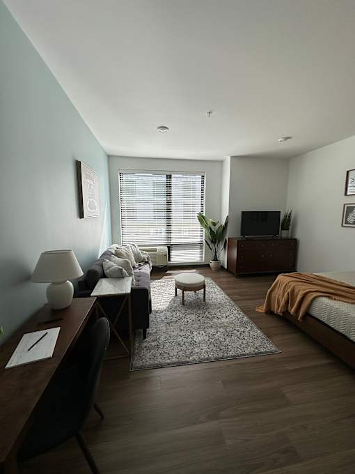 Studio apartment with seating area and workspace at The Traveler Apartments, Omaha, 68131