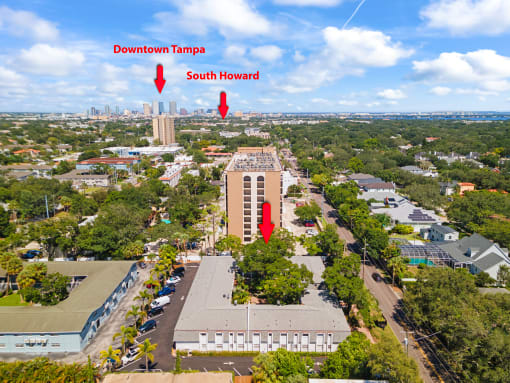 an aerial view of the building with two red arrows pointing to the south and north elevators