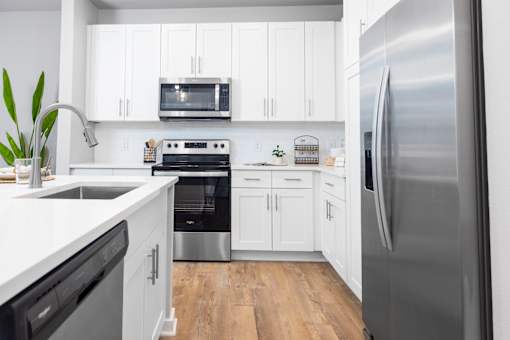 Kitchen with Stainless-Steel Appliances at The Residences at Enso, Jacksonville, Florida