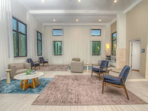 a living room filled with furniture and a rug
