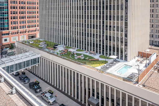 A view of a city street with cars and buildings.