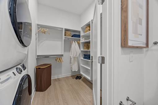 A small laundry room with a washer and dryer.at Adler Montford Park + Drexel Townes, Charlotte, NC, 28209