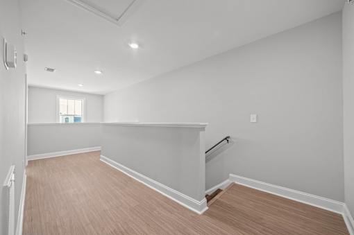 A room with a window and a staircase.at Regency Townes, North Carolina, 28590 