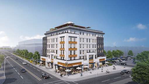 A modern building with a flat roof and a balcony on the top floor is surrounded by a busy street with cars and pedestrians.